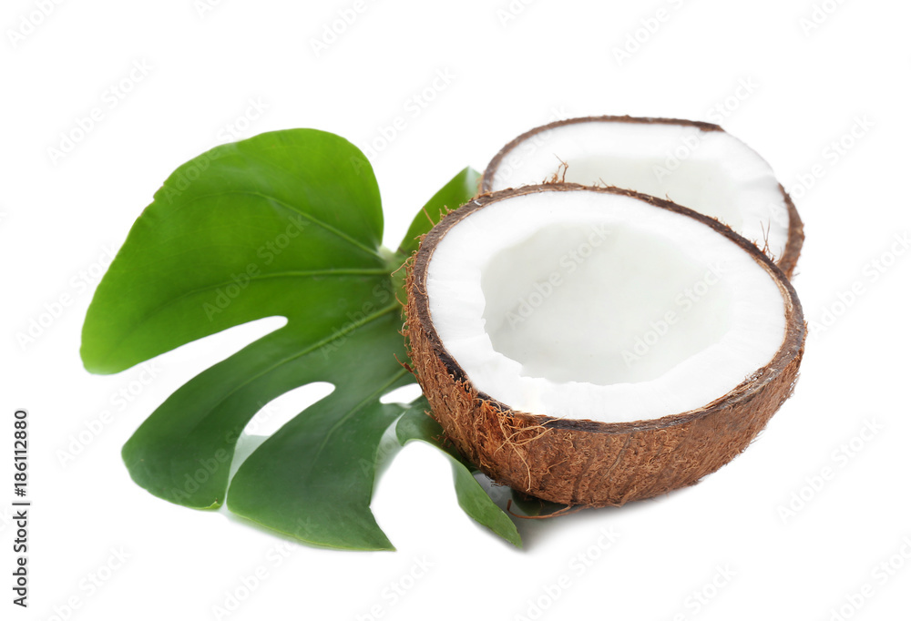 Halves of coconut with leaf on white background Halves of coconut with leaf on white background