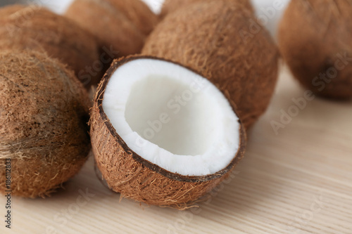 Pile of ripe coconuts on wooden background