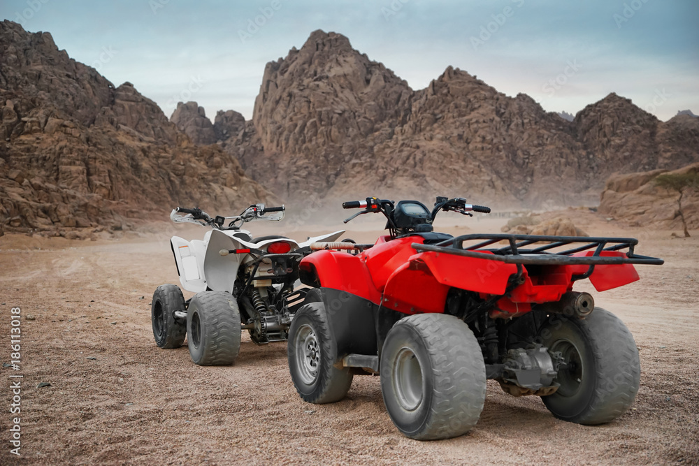 Modern quad bikes in desert Modern quad bikes in desert