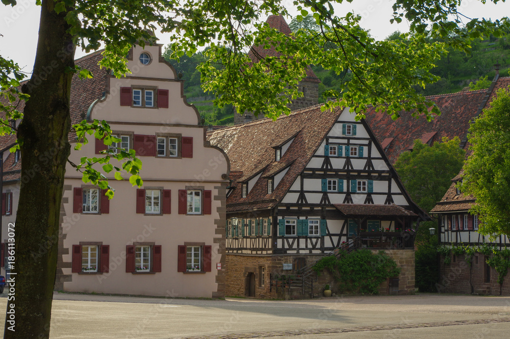 MAULBRONN, GERMANY - MAI 17, 2015: row Tudor style houses at the monastery is part of the UNESCO World Heritage Site. MAULBRONN, GERMANY - MAI 17, 2015: row Tudor style houses at the monastery is part of the UNESCO World Heritage Site.