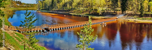 Tableau sur toile Panoramic view of pedestrian bridge on pontoons (Ogre, Latvia)
