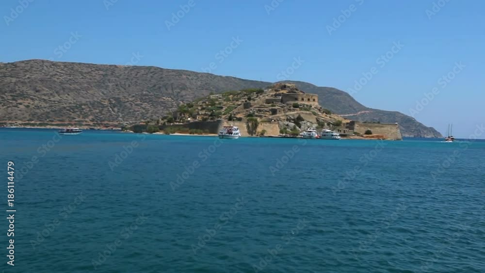 Cretan island of Spinalonga. Crete. Greece. Sea voyage by boat to the island of Spinalonga, location of the last leper colony in the whole of Europe. Cretan island of Spinalonga. Crete. Greece. Sea voyage by boat to the island of Spinalonga, location of the last leper colony in the whole of Europe.