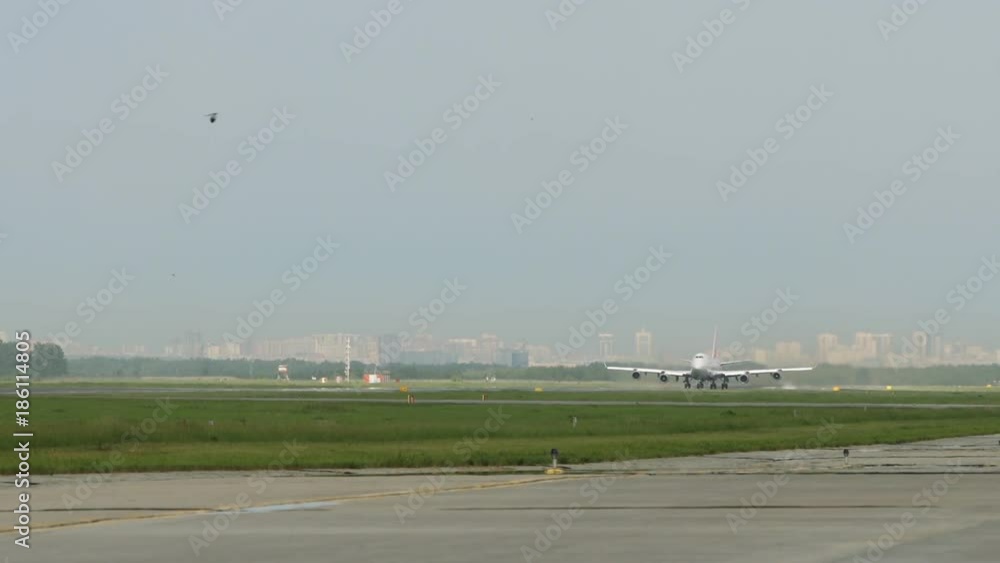 Airplane moves along runway Airplane moves along runway