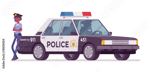 Young policewoman standing near car