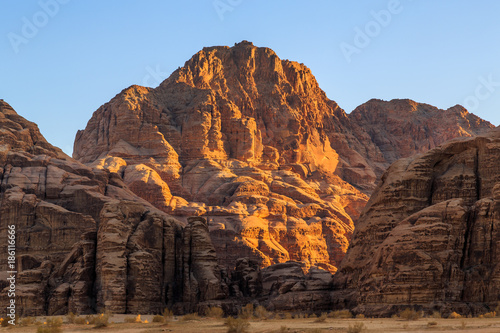View of the yellow colored mountain rocks in the Wadi rum desert in Jordan at early-morning