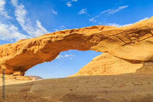 Scenic view of the yellow colored arch rock in the Wadi rum desert in Jordan