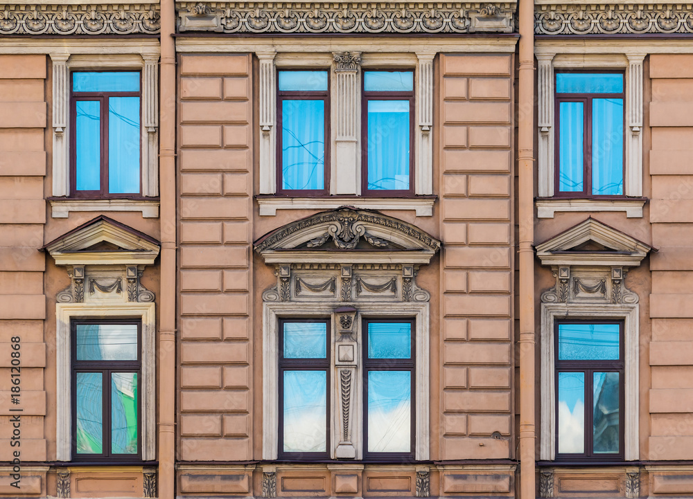 Several windows in a row on the facade of the urban historic building front view, Saint Petersburg, Russia
Several windows in a row on the facade of the urban historic building front view, Saint Petersburg, Russia
