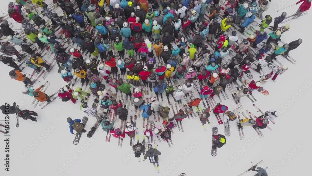 Ski resort. Skiers and snowboarders stand in line for a ski lift. Winter extreme holidays in the mountains. Skiing. Aerial view. Carpathians, Ukraine Ski resort. Skiers and snowboarders stand in line for a ski lift. Winter extreme holidays in the mountains. Skiing. Aerial view. Carpathians, Ukraine