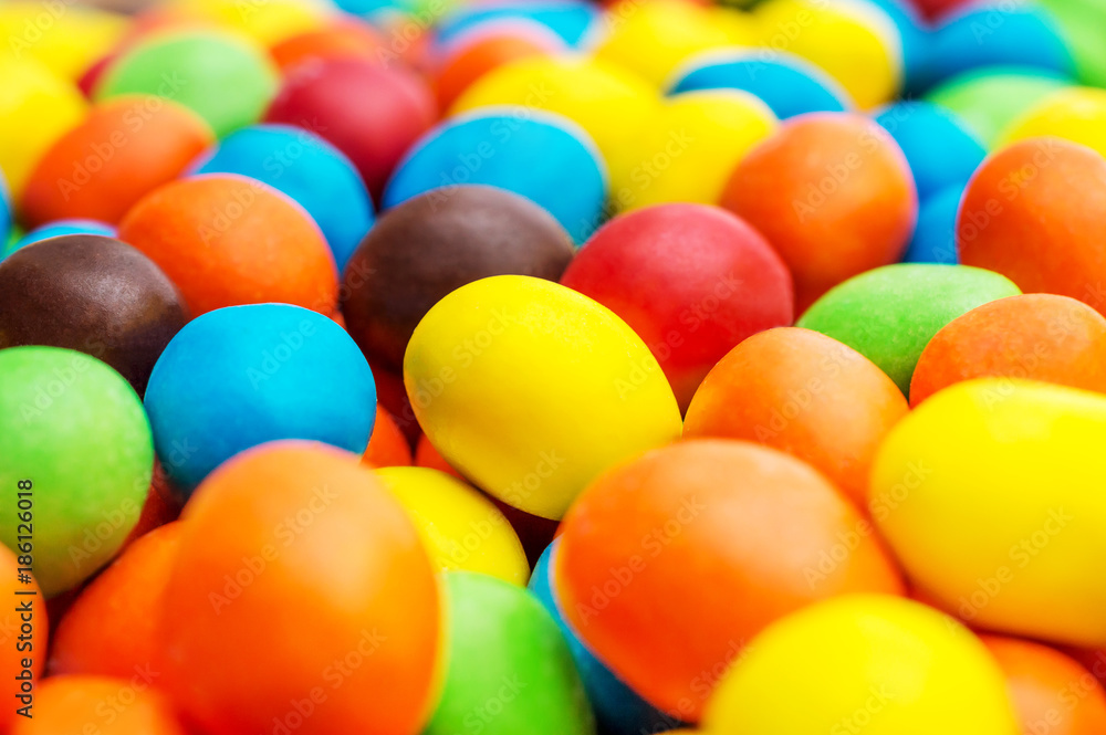Sweet round multi colored candies. Close up. Abstract and food background. Sweet round multi colored candies. Close up. Abstract and food background.