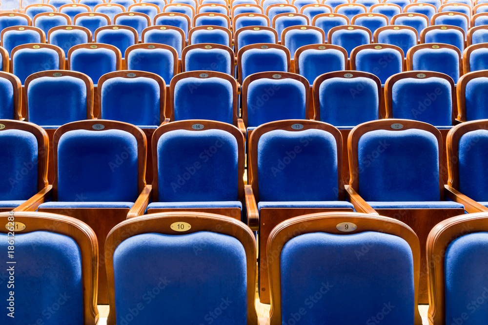 Fototapeta premium Blue brown wooden chairs in the auditorium. Without people.