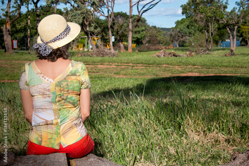 Obraz premium Lady Relaxing and Enjoying the Outdoors