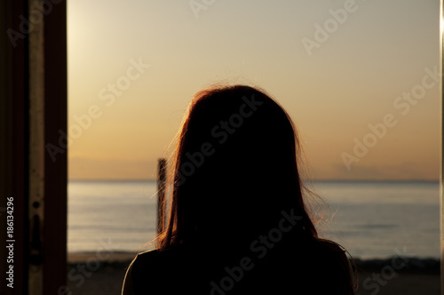 Woman looking beyond the horizon