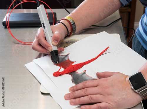 3-D printing pen creating a dragon shape