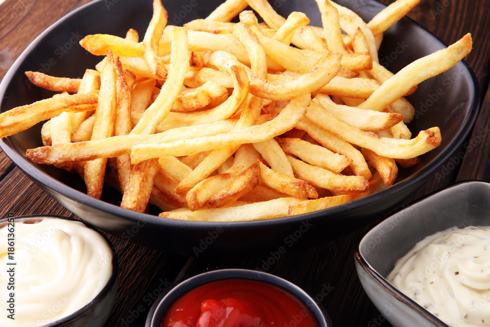 Red and white french fries chips with ketchup and mayonnaise Red and white french fries chips with ketchup and mayonnaise