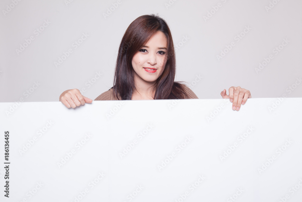 Young Asian woman with blank sign. Young Asian woman with blank sign.
