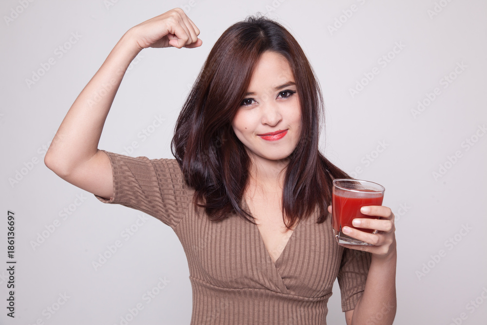 Strong healthy Asian woman with tomato juice. Strong healthy Asian woman with tomato juice.