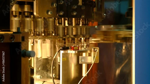 PET bottle preforms. The operation of PET bottle or plastic bottle blowing machine with lighting effect.