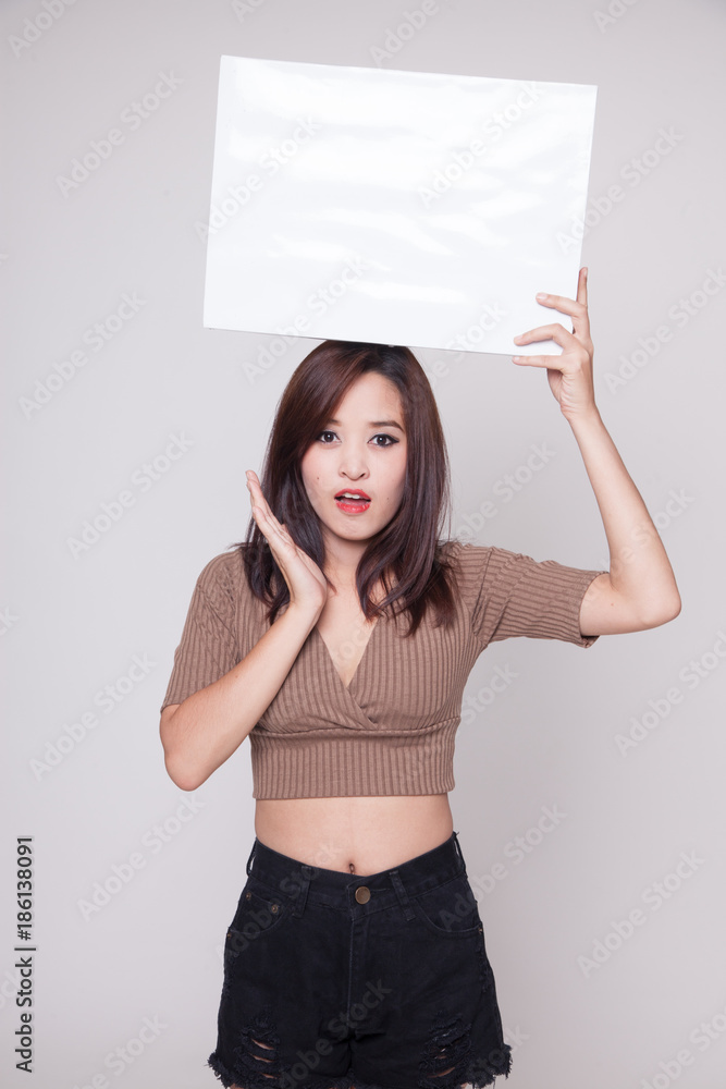 Young Asian woman surprise with white blank sign. Young Asian woman surprise with white blank sign.