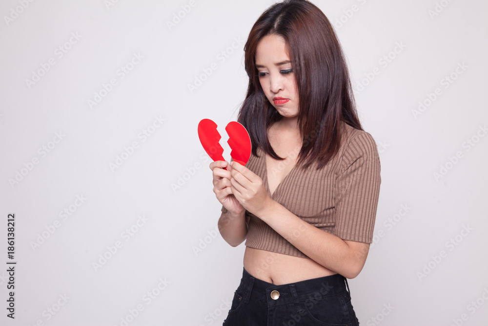 Beautiful young Asian woman with broken heart. Beautiful young Asian woman with broken heart.