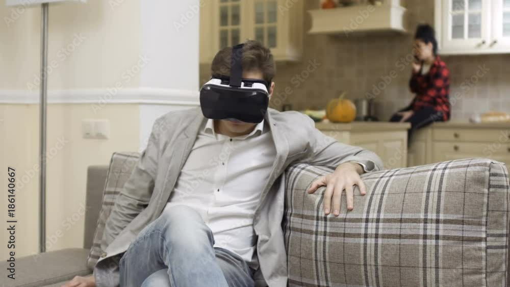 Young guy in virtual reality glasses Young guy in virtual reality glasses
