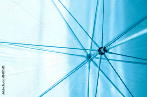 blue abstract background, umbrella spokes, rays. Concept for computer background