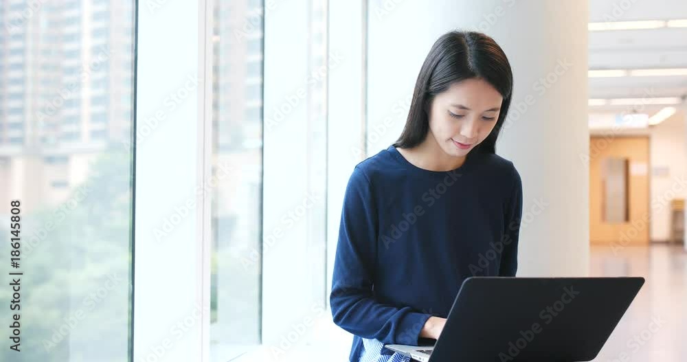 Student doing homework on laptop computer inside university campus Student doing homework on laptop computer inside university campus