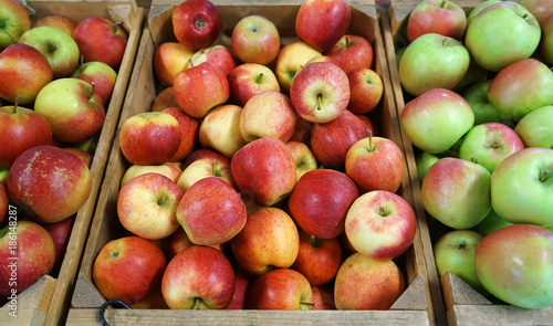 Green and red apples in farm store for sale