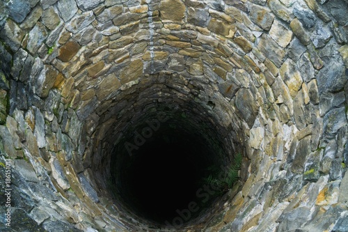 Deep water well in the town, inside. Slovakia photo