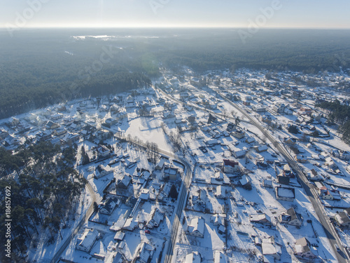 Aerial view over Druskininkai suburban houses during snowy cold winter, Lithuania.