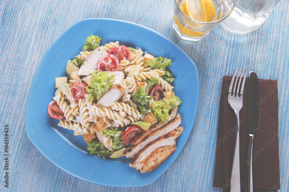 caesar salad pasta avocado chicken fillet tomato sauce  close up