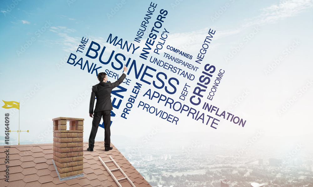 Young businessman standing on house roof and writing leadership skill concept. Mixed media Young businessman standing on house roof and writing leadership skill concept. Mixed media