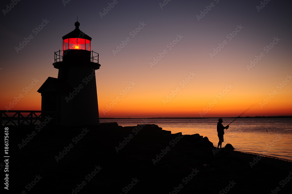 fisherman off Brant Point at dawn