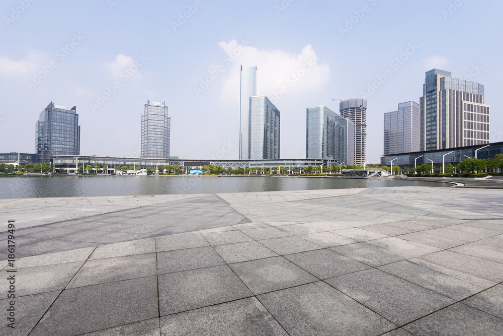 modern buildings near water in modern city modern buildings near water in modern city