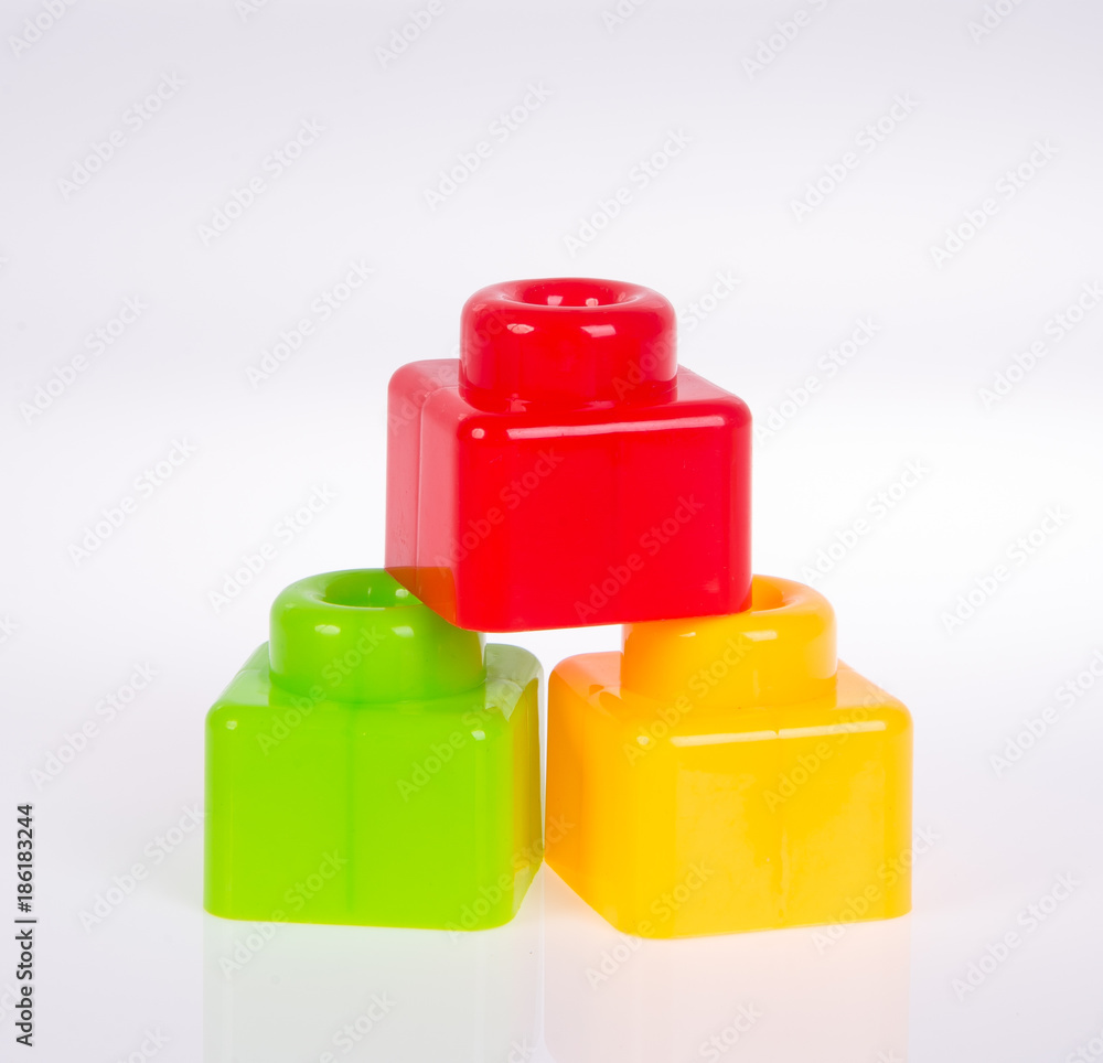 Plastic building blocks or colour blocks on a background. Plastic building blocks or colour blocks on a background.