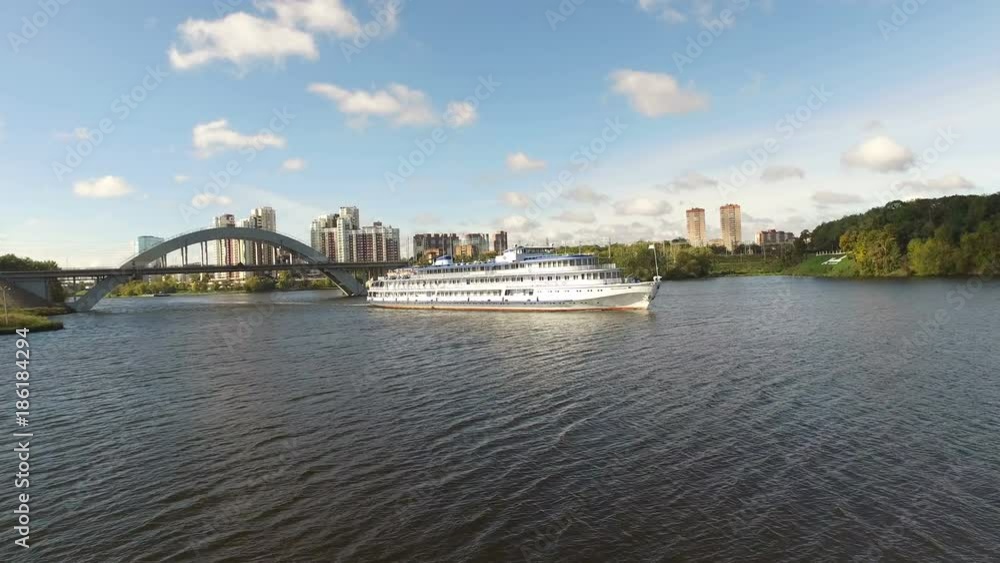 Ship on the river against the background of the bridge Ship on the river against the background of the bridge