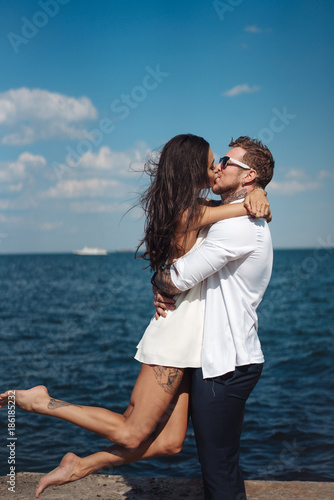 Guy and girl on the sea pier © teksomolika