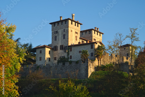 Autumn view of the medieval Cassacco castle in Friuli with the sunrise light, Italy 