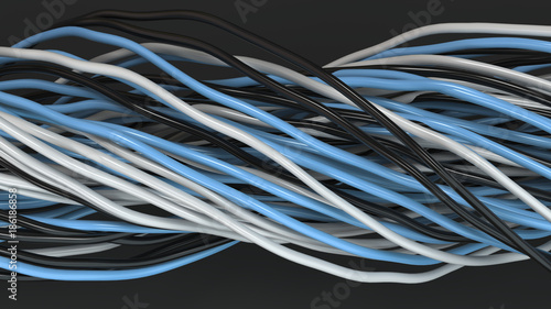 Twisted black, white and blue cables and wires on black surface