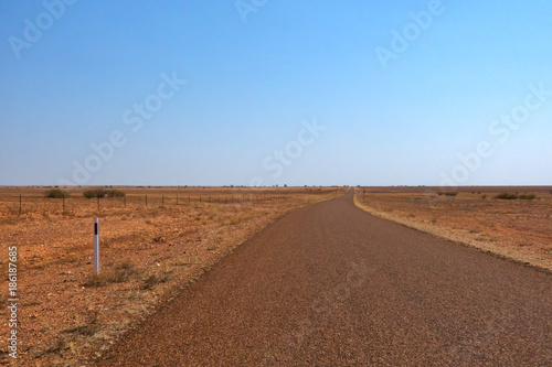 Long flat road near Boulia in Outback Queensland photo