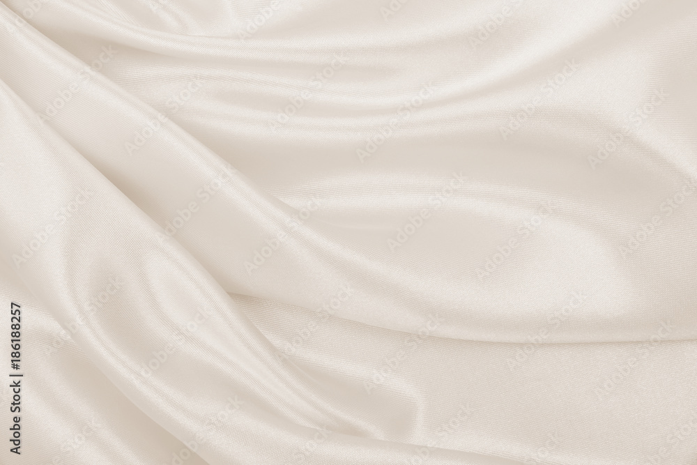 Obraz premium Smooth elegant golden silk or satin luxury cloth texture as wedding background. Luxurious Christmas background or New Year background design. In Sepia toned. Retro style