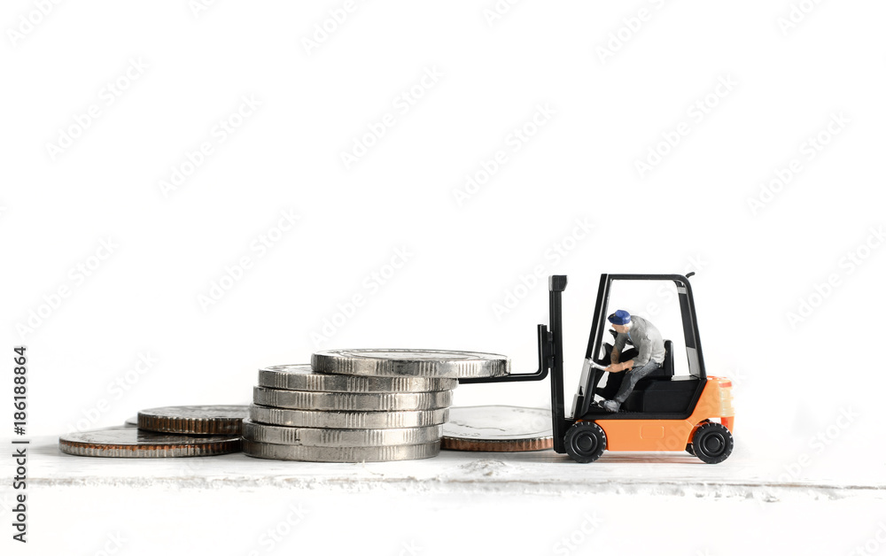 miniature worker driver on forklift truck loading stack coins miniature worker driver on forklift truck loading stack coins