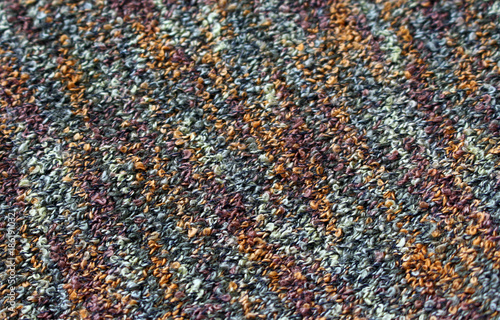 knitted fabric of wool as the background.