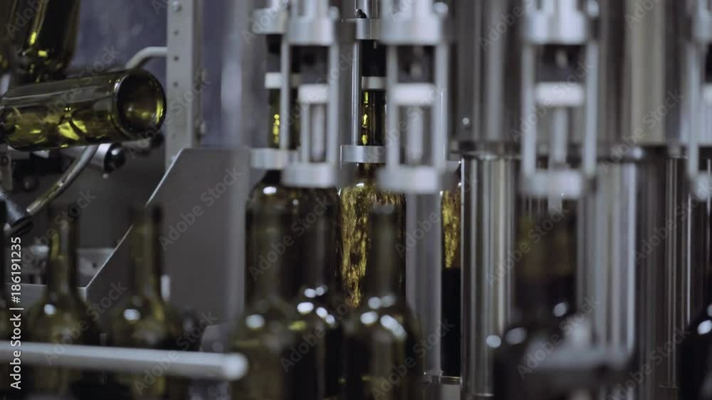 Wine bottles filling in from the conveyor. 4k Wine bottles filling in from the conveyor. 4k