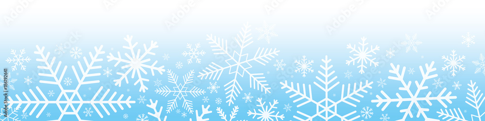 Snowflakes on blue gradient background.