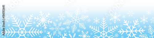 Snowflakes on blue gradient background.