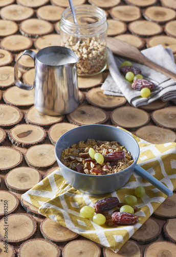 Corn bowl with sliced banana  blueberry and strawberry on wooden table  closeup view. Healthy eating  healthy breakfast dieting concept