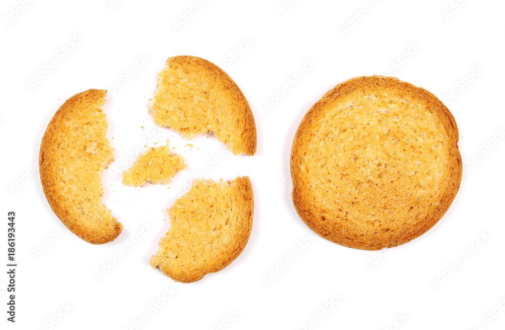 Integral crumbled rusks with wholewheat flour, bread slices isolated on white background, top view Integral crumbled rusks with wholewheat flour, bread slices isolated on white background, top view