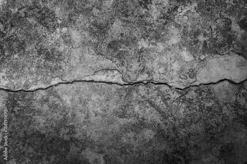 Grungy wall with large crack cement floor texture,cement large crack for dark background photo