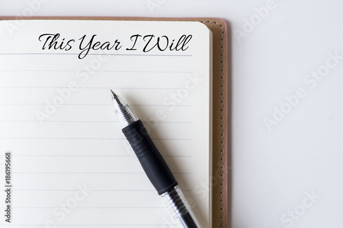 Wallpaper Mural Conceptual,notebook on a white table. open diary and pen with this year i will words Torontodigital.ca