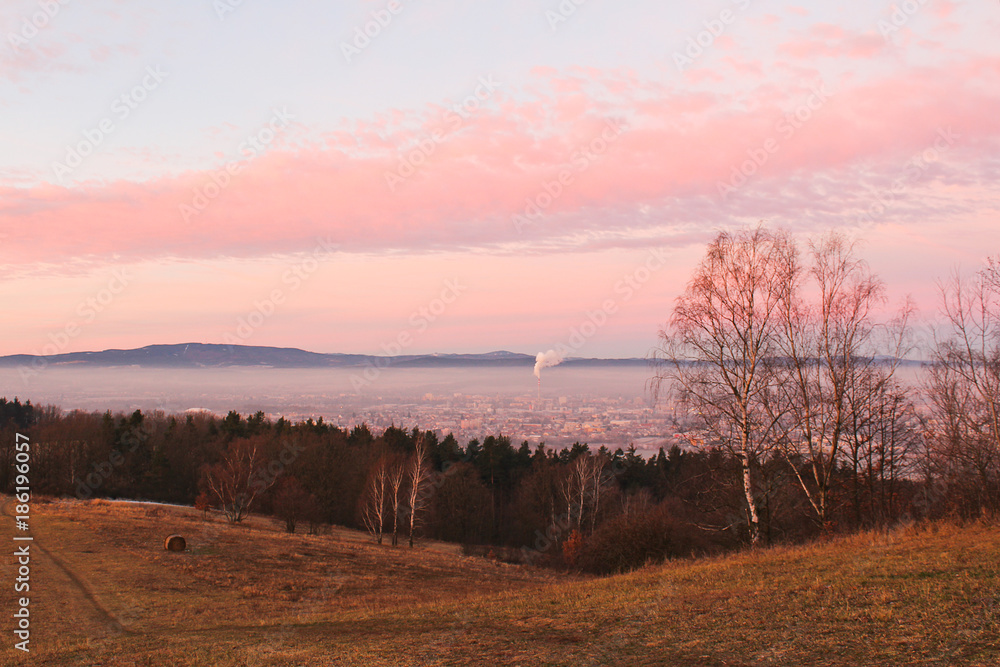 Amazing winter sunrise over city Ceske Budejovice and hill Klet, Czech landscape